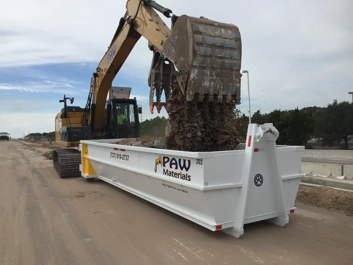 Roll-off dumpster container on a commercial job site