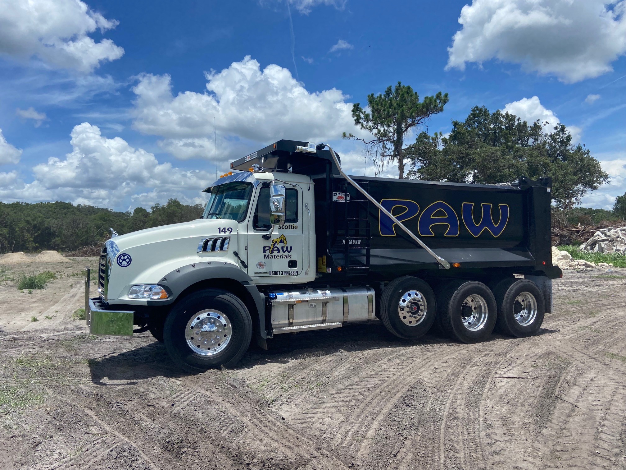 PAW Materials dump truck on a Central Florida job site